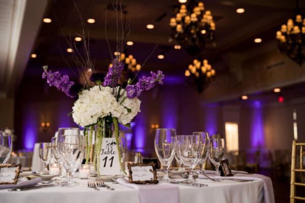 Wedding reception with purple uplights
